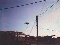 Sky Crane delivering M102 and accessories next door  1969